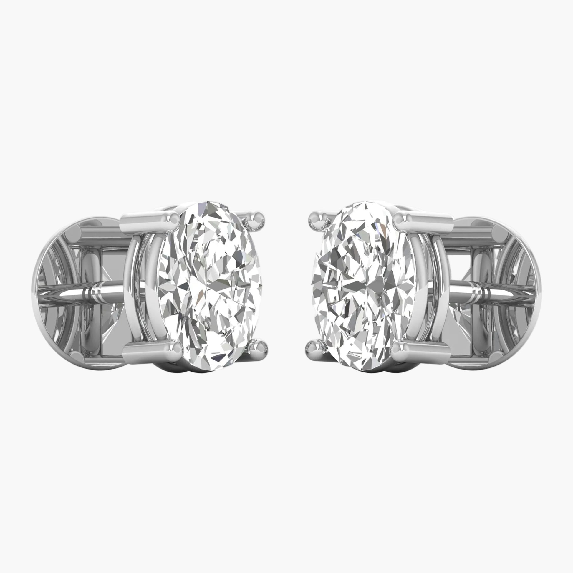Pair of diamond stud earrings on a white background