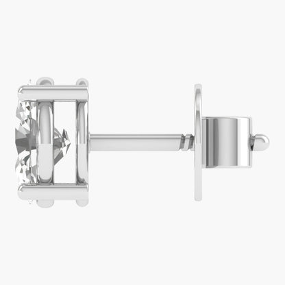 Silver earring with a clear gemstone on a white background