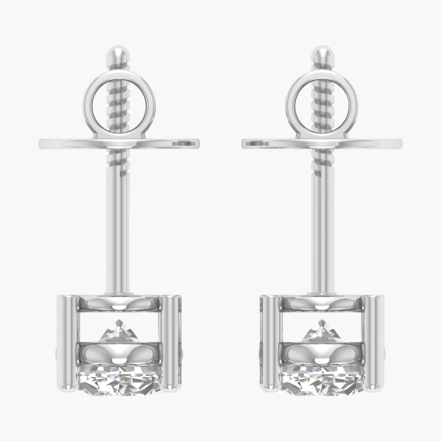 Pair of silver earrings with intricate designs on a white background