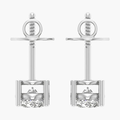 Pair of silver earrings with intricate designs on a white background