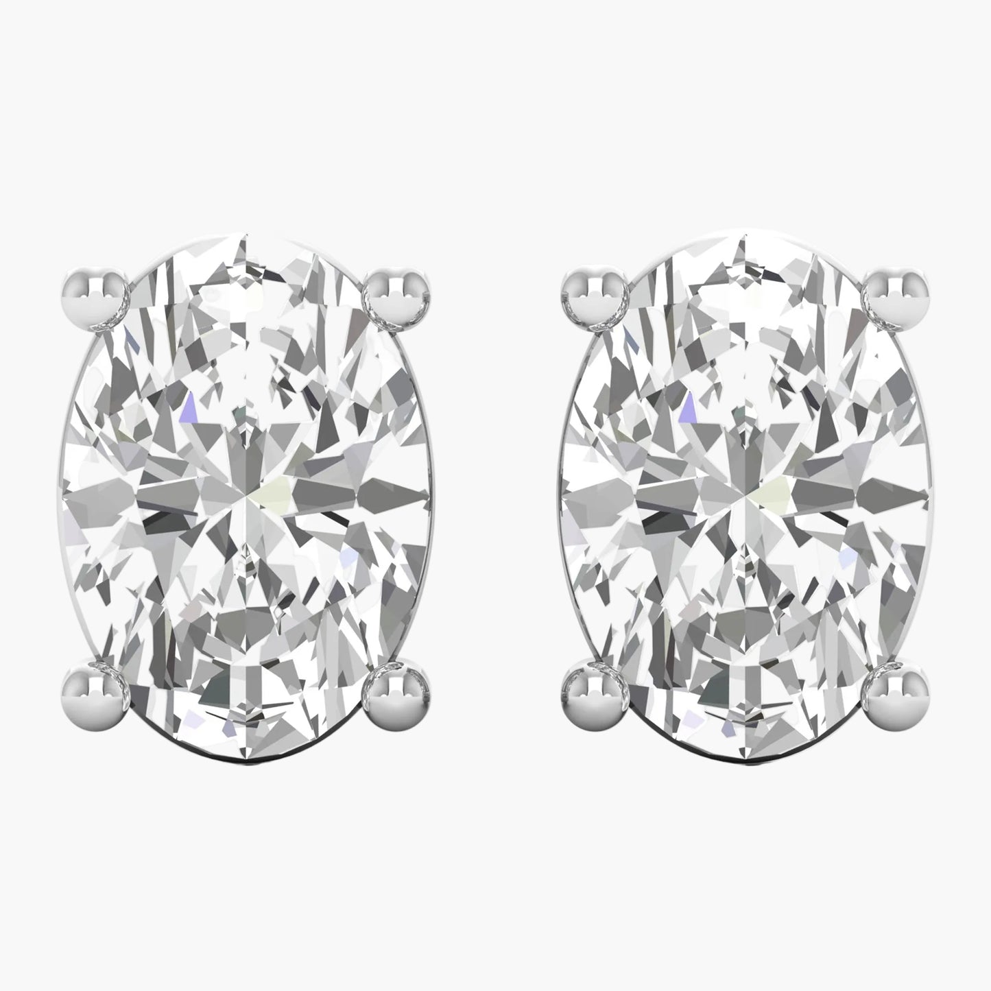 Pair of diamond stud earrings on a white background