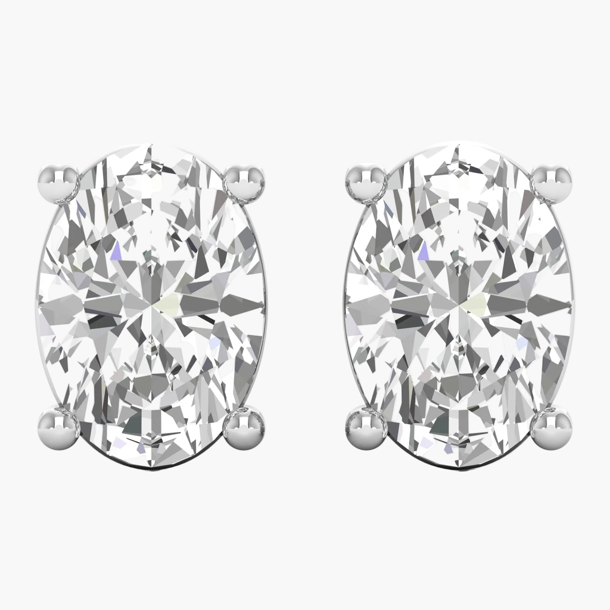 Pair of diamond stud earrings on a white background