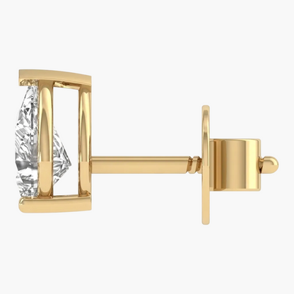 Gold earring with a clear gemstone on a white background