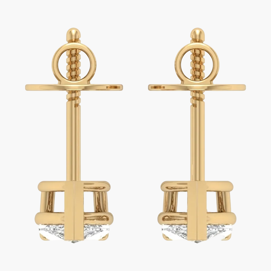 Gold anchor-shaped earrings on a white background
