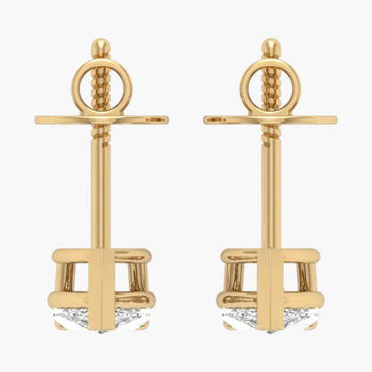 Gold anchor-shaped earrings on a white background