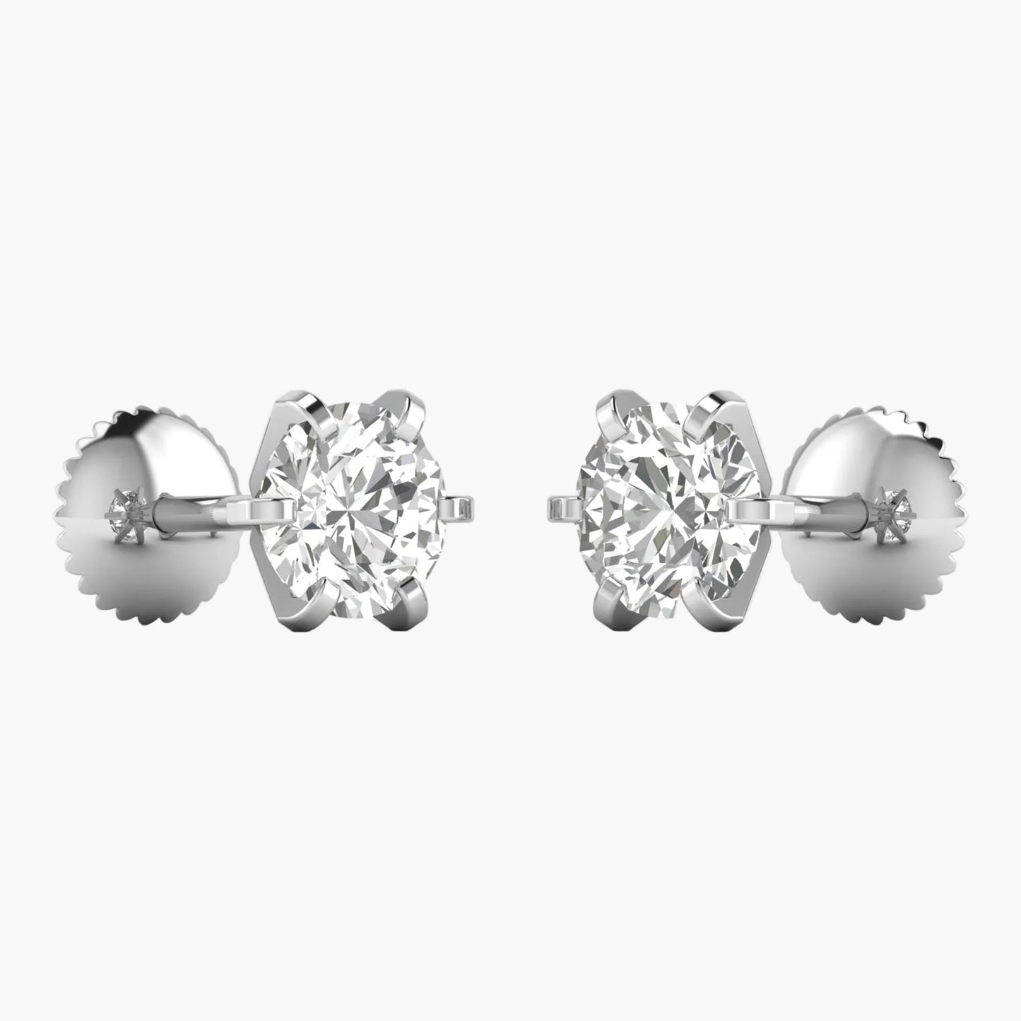 Pair of diamond stud earrings on a white background