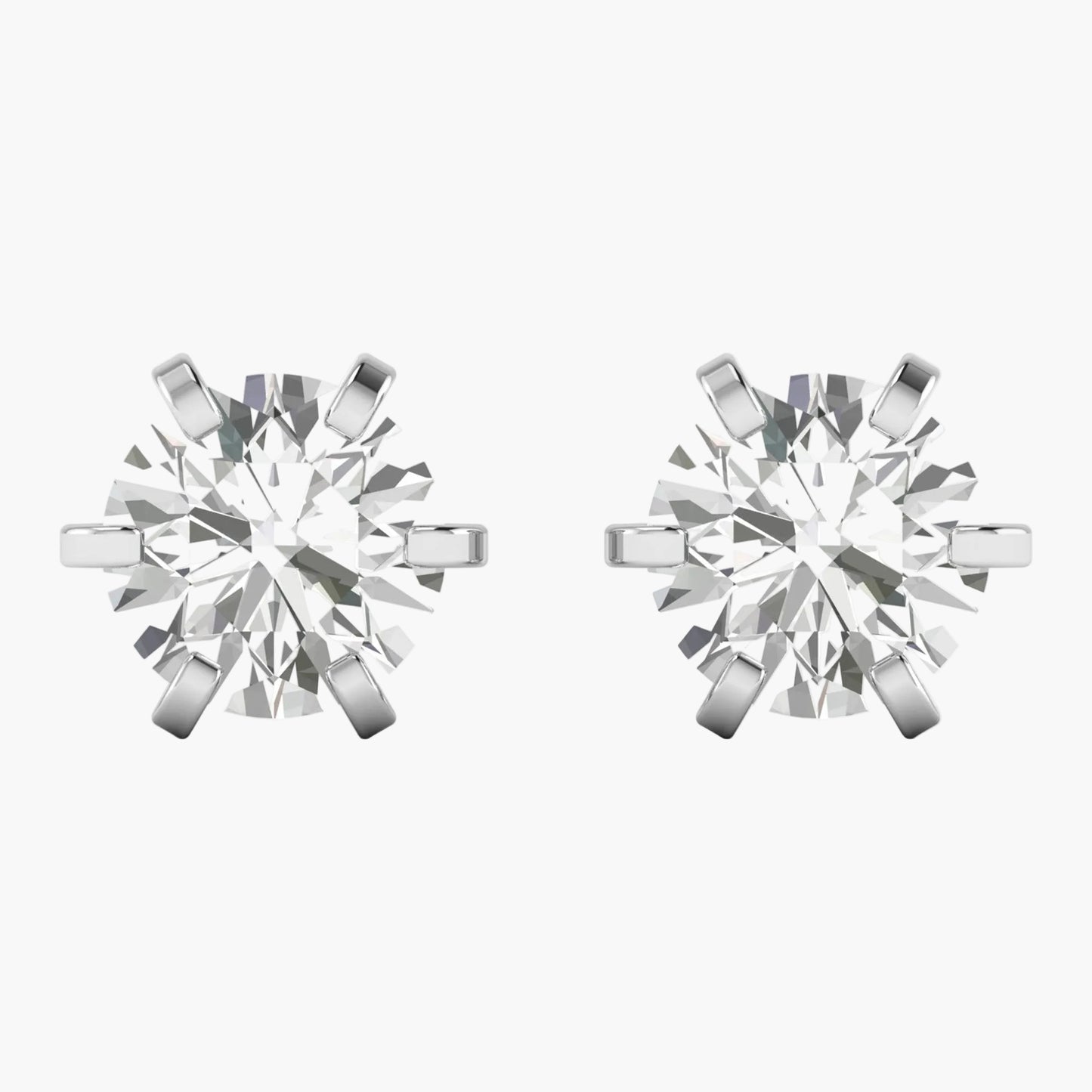 Pair of diamond stud earrings on a white background