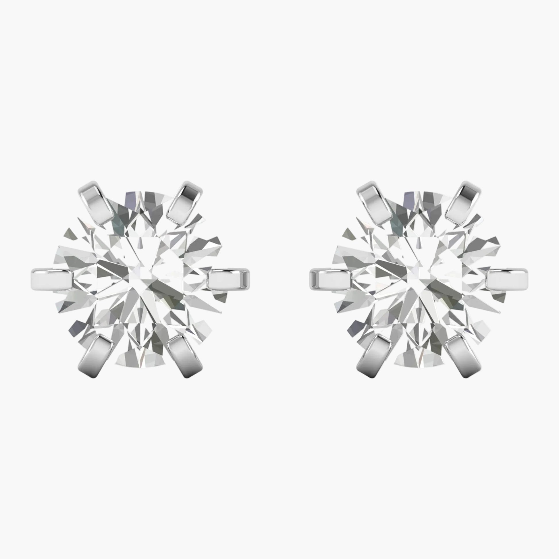 Pair of diamond stud earrings on a white background