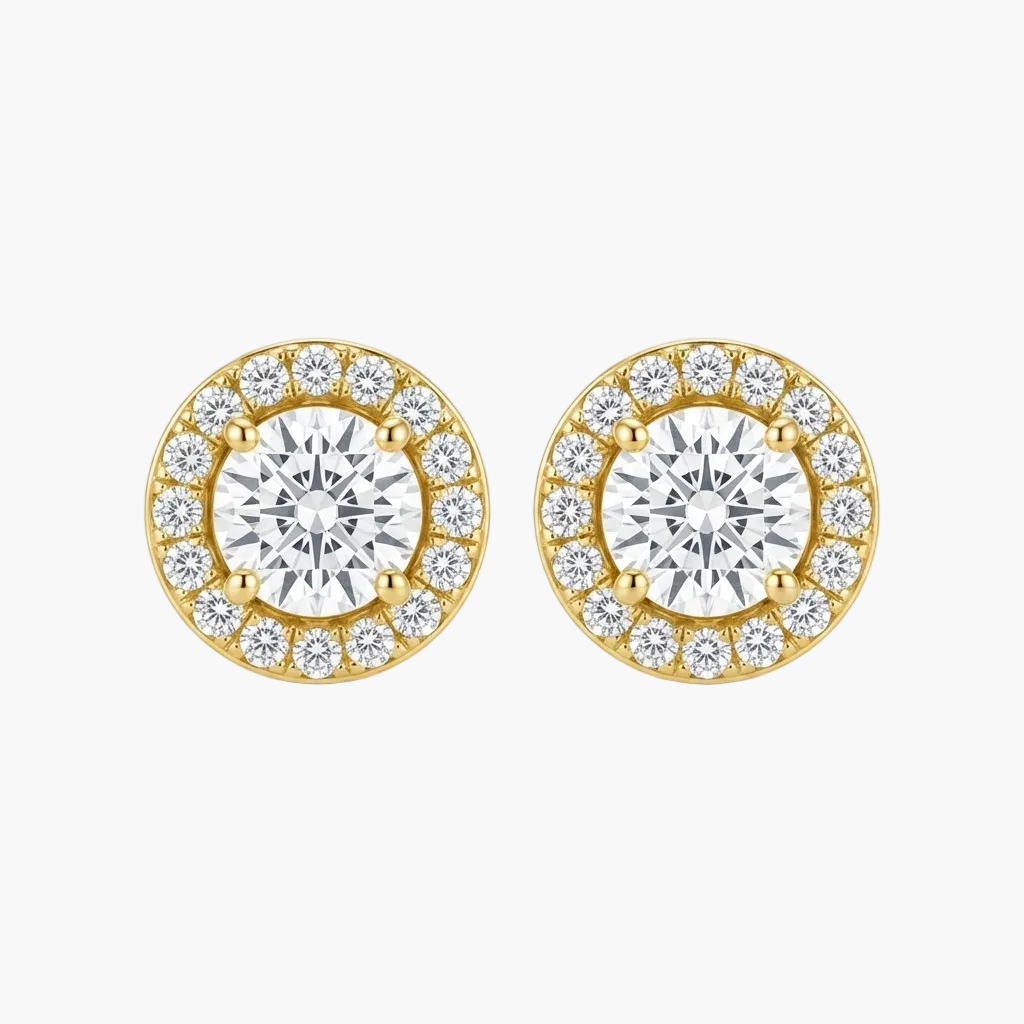 A pair of yellow gold stud earrings with a halo design, featuring a large round center stone surrounded by smaller round stones, set against a plain white background.