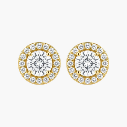 A pair of yellow gold stud earrings with a halo design, featuring a large round center stone surrounded by smaller round stones, set against a plain white background.