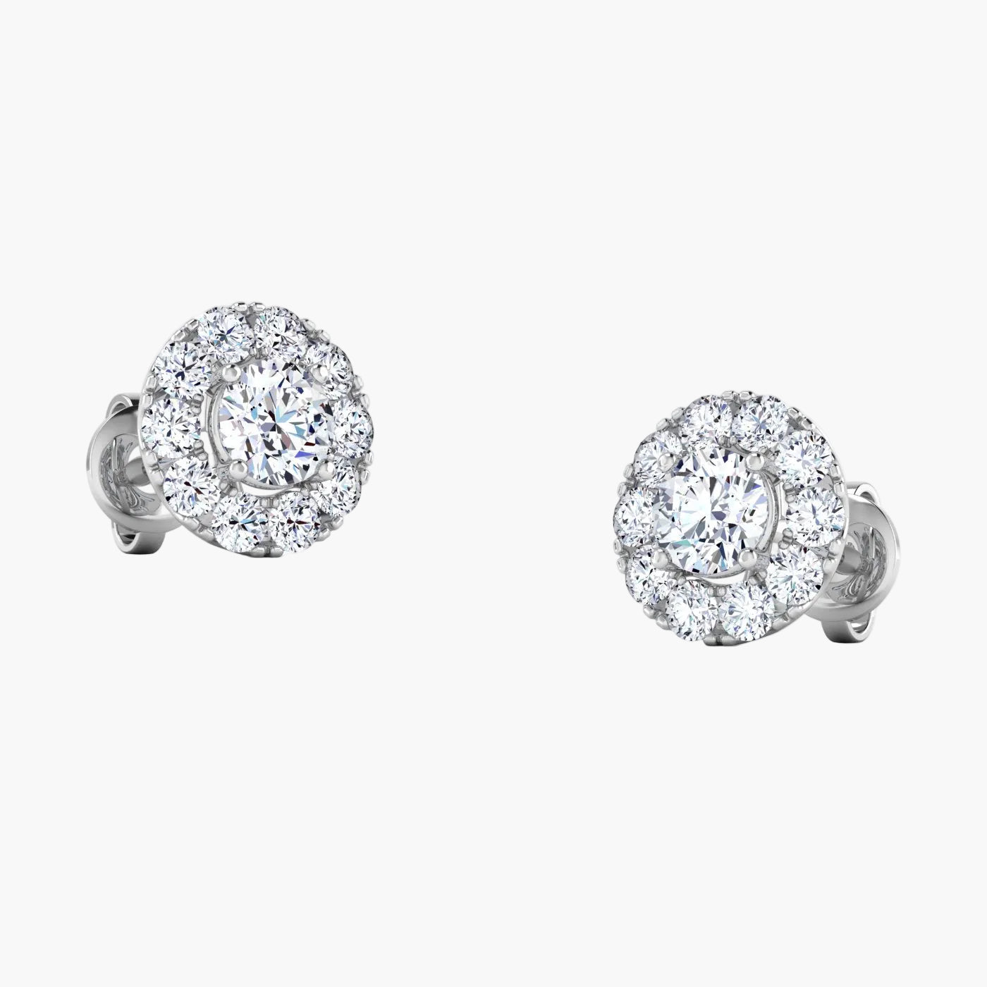Pair of diamond stud earrings on a white background