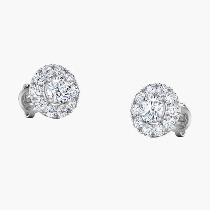 Pair of diamond stud earrings on a white background