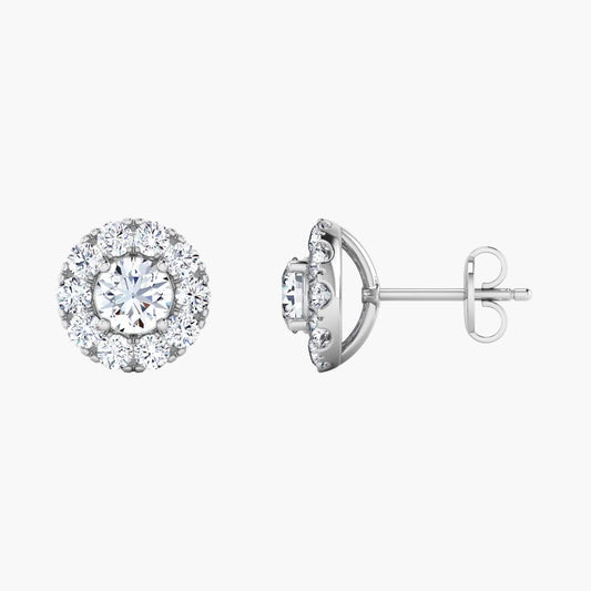 Pair of diamond stud earrings on a white background