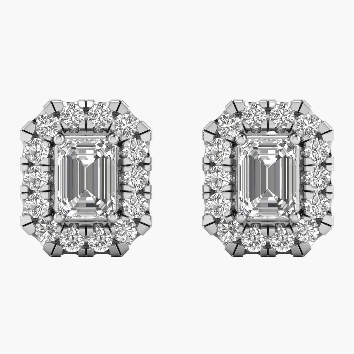 Pair of diamond earrings with emerald-cut center stones on a white background