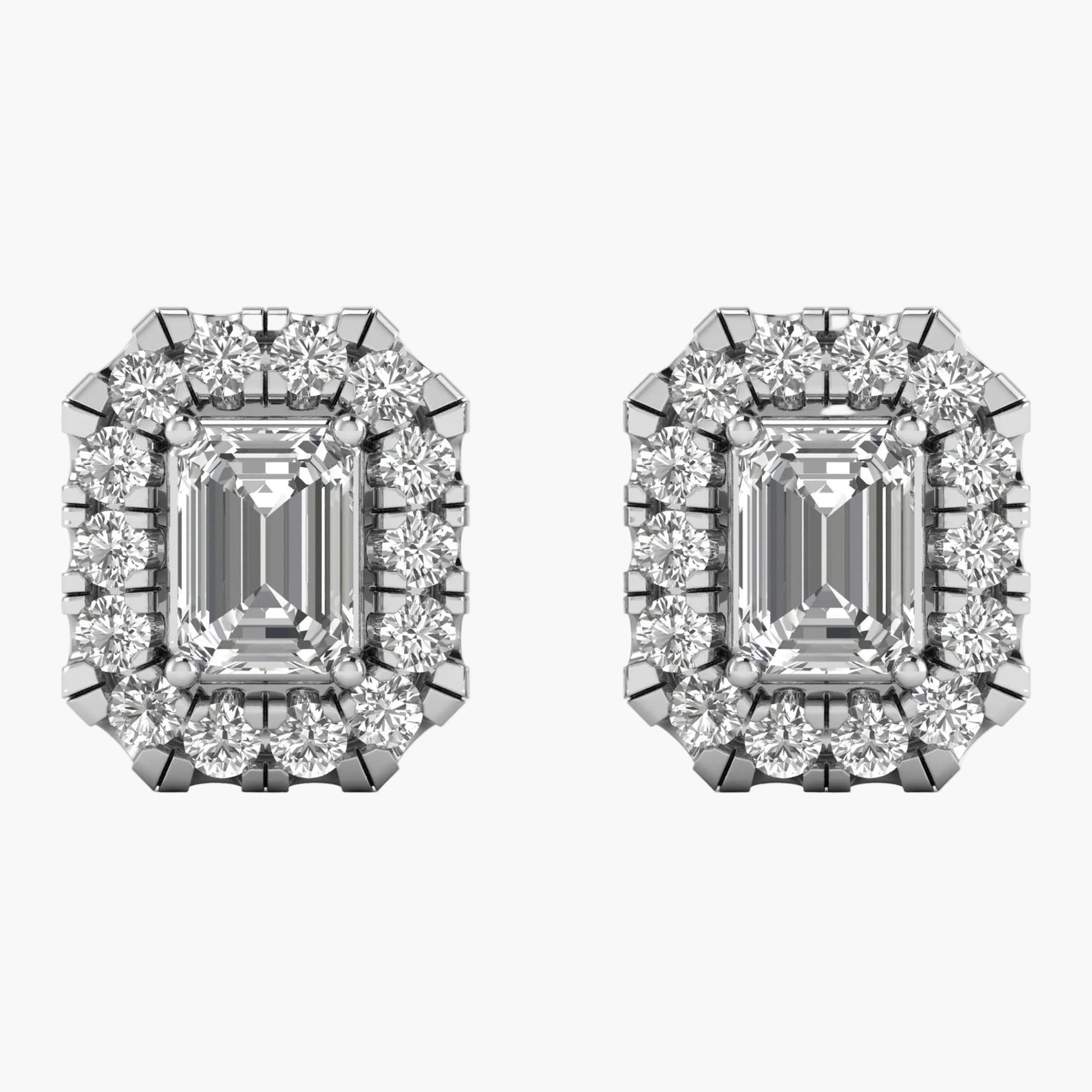 Pair of diamond earrings with emerald-cut center stones on a white background