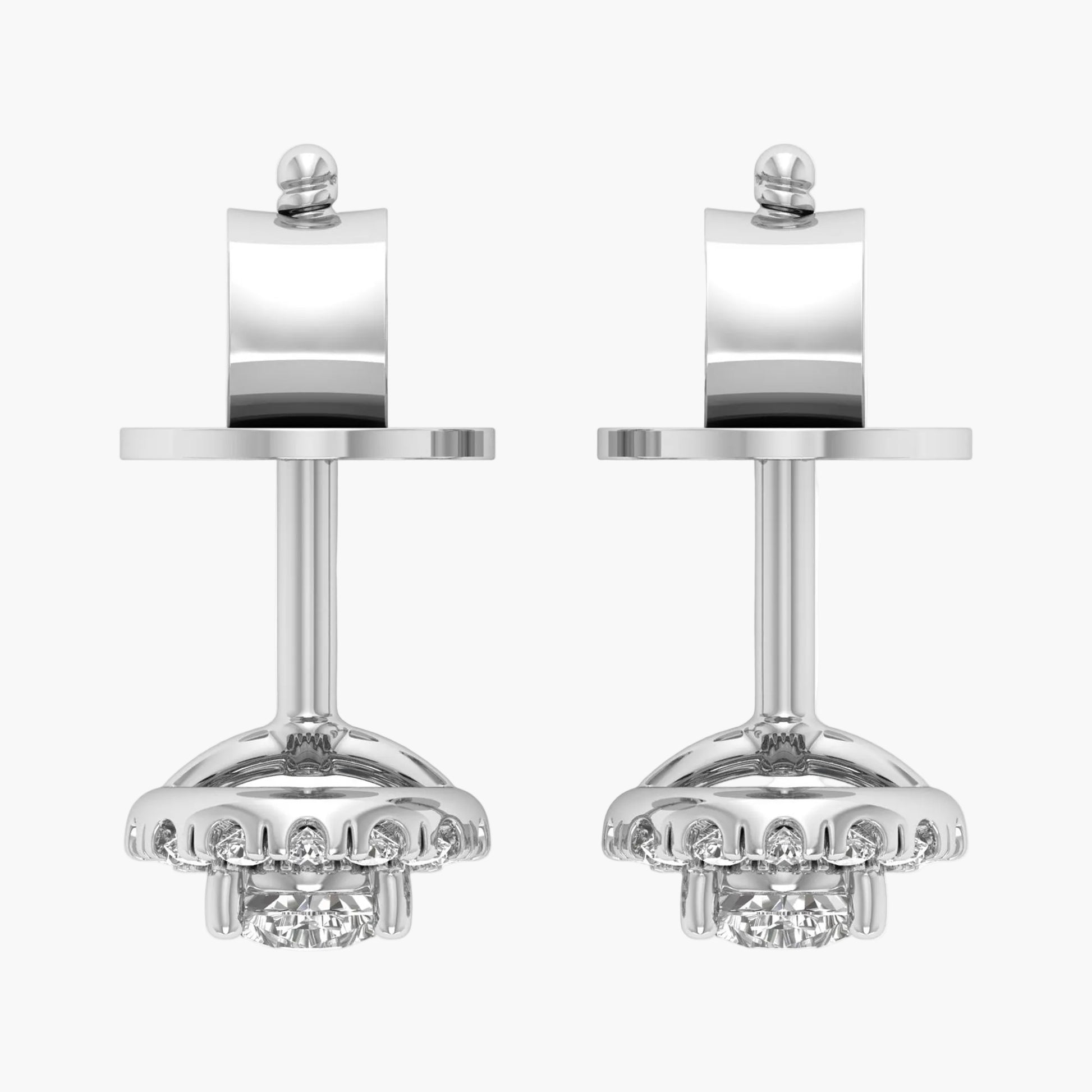 Pair of silver earrings with intricate designs on a white background