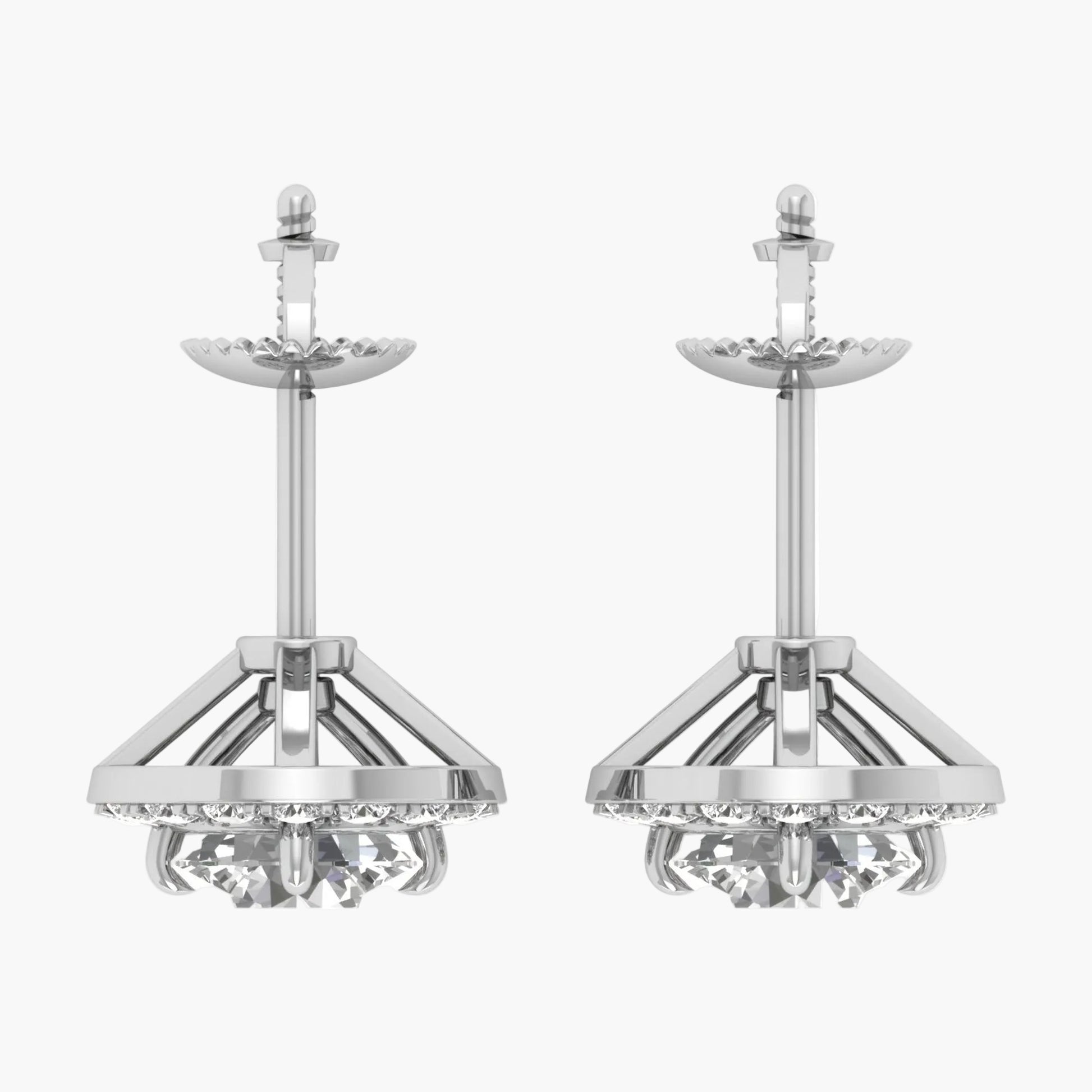Pair of silver earrings with intricate designs on a white background