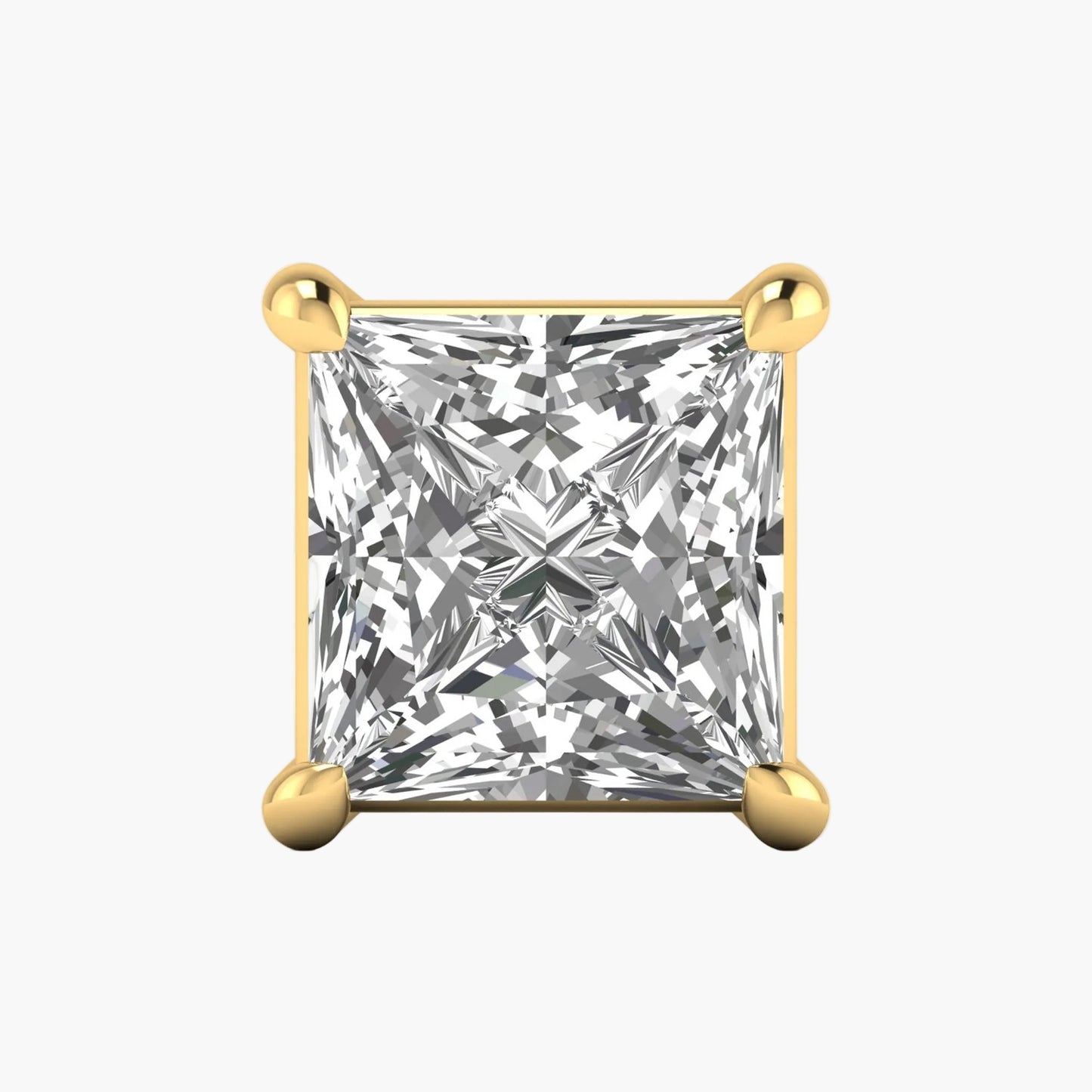 Gold earring with a clear gemstone on a white background