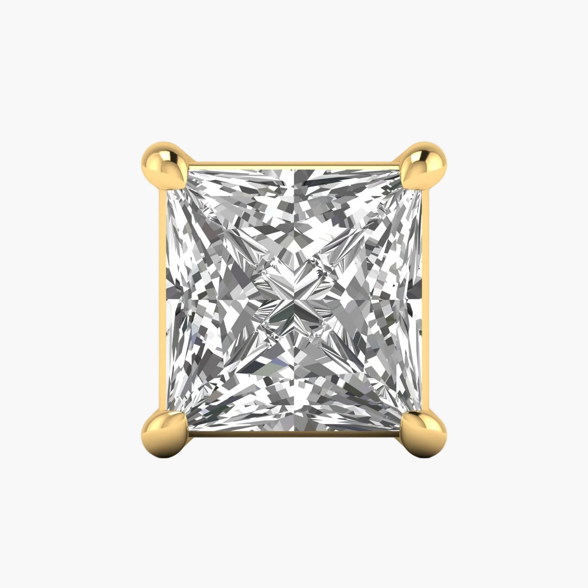 Gold earring with a clear gemstone on a white background