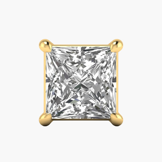 Gold earring with a clear gemstone on a white background