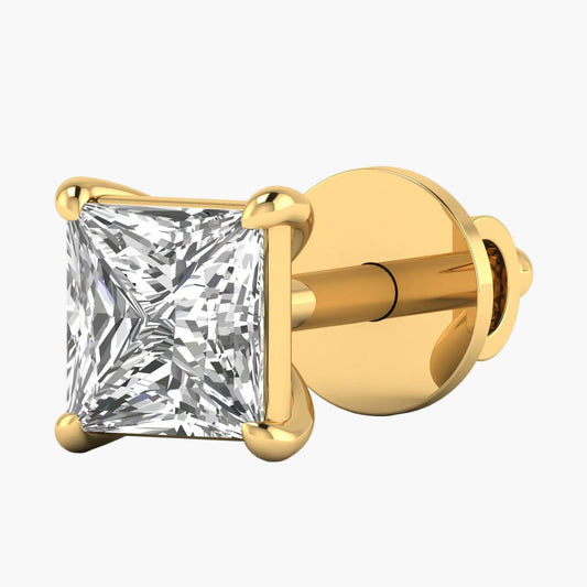 Gold stud earring with a clear gemstone on a white background