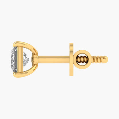 Gold earring with a diamond on a white background
