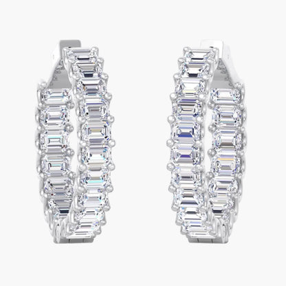 Pair of diamond hoop earrings on a white background