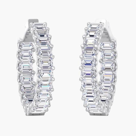 Pair of diamond hoop earrings on a white background