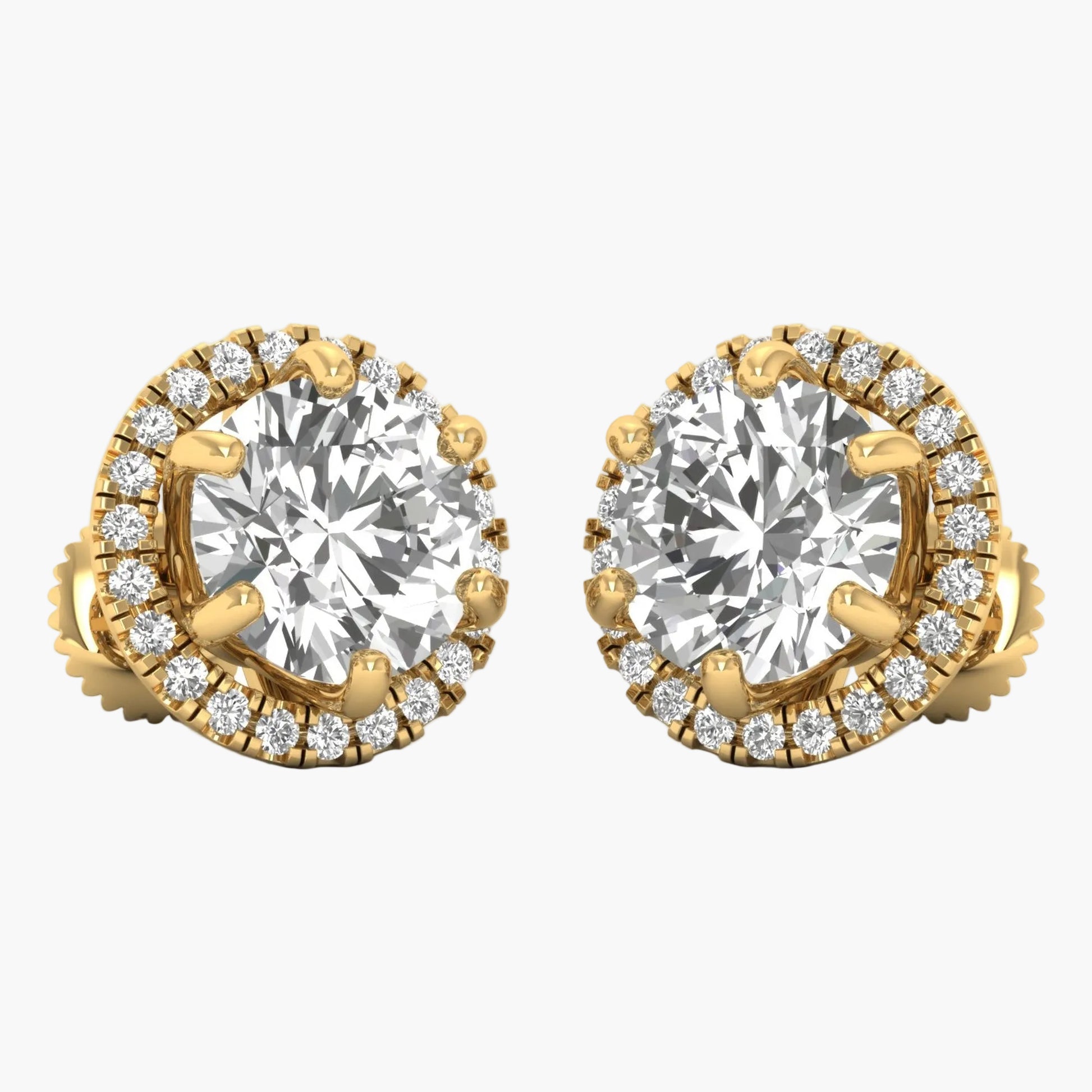 Gold earrings with large central gemstones and smaller diamonds on a white background