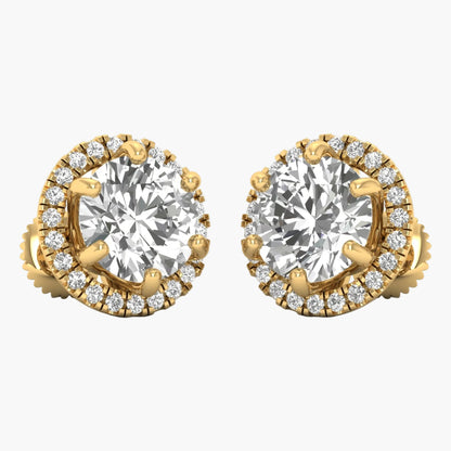 Gold earrings with large central gemstones and smaller diamonds on a white background