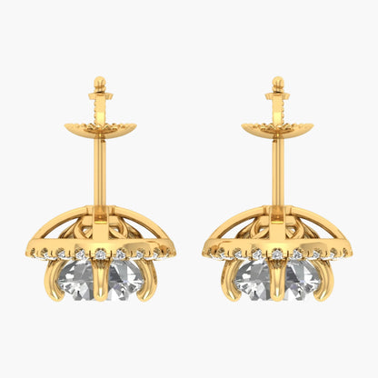 Gold earrings with clear gemstones on a white background