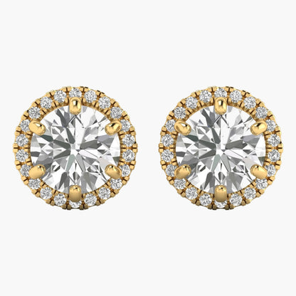 Gold and silver round earrings with clear gemstones on a white background