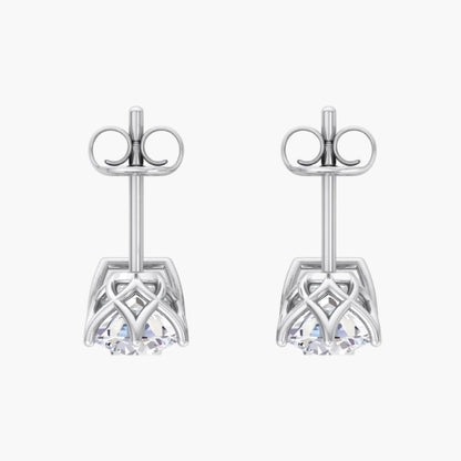 Pair of silver earrings with intricate designs on a white background