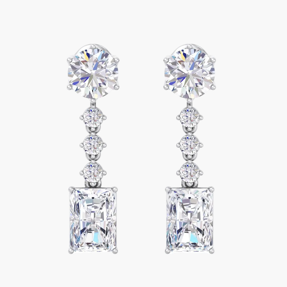 Pair of diamond earrings on a white background