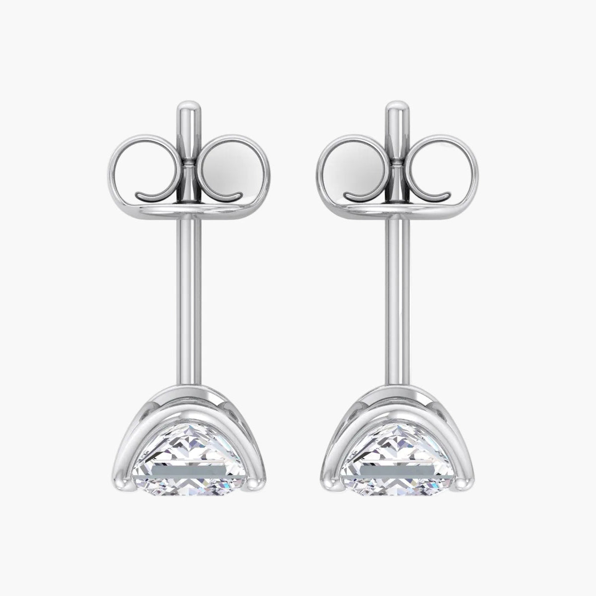 Pair of silver stud earrings with clear gemstones on a white background