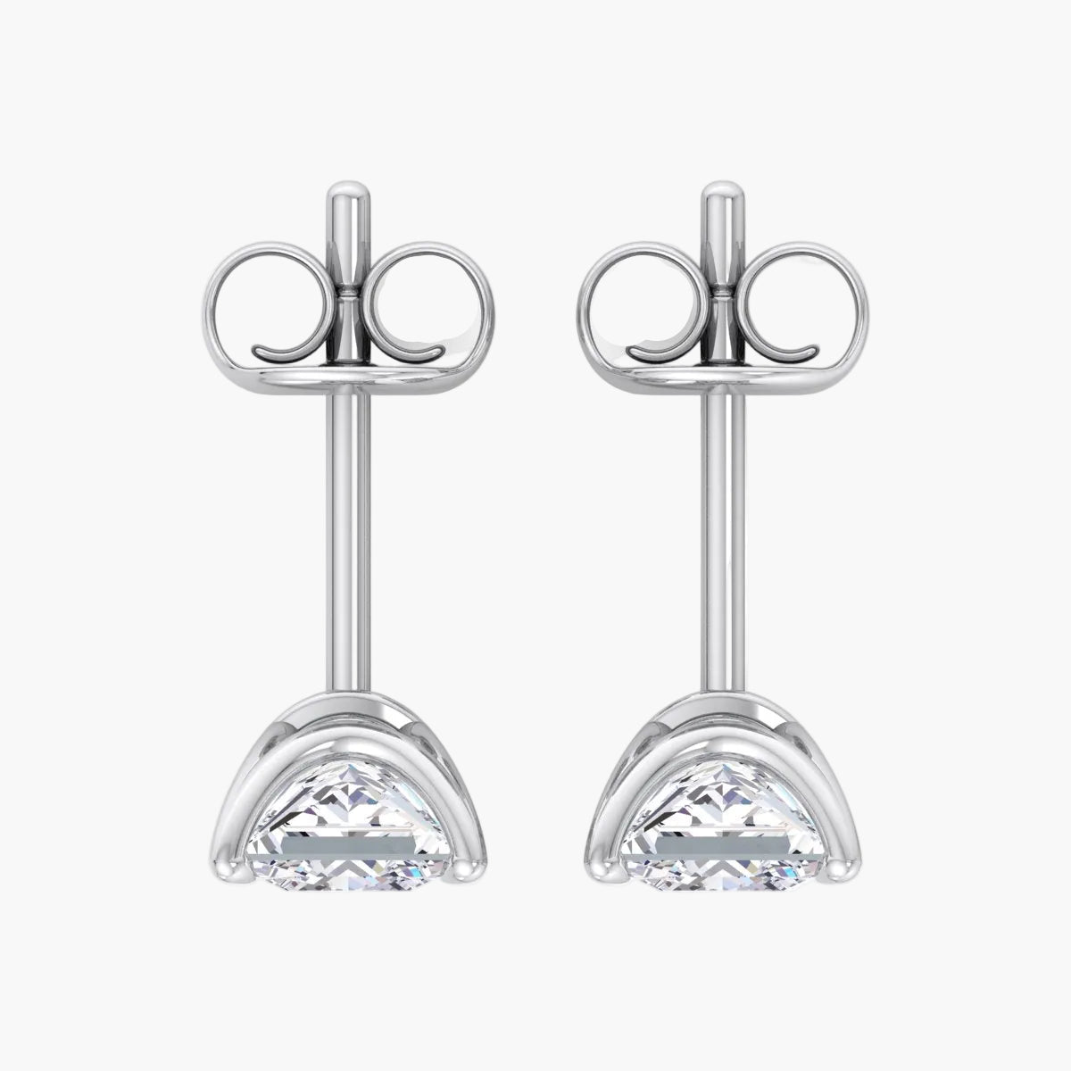 Pair of silver stud earrings with clear gemstones on a white background