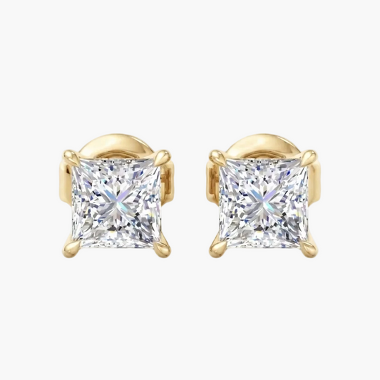 A pair of princess-cut diamond stud earrings in yellow gold four-prong settings, shown on a clean white background.