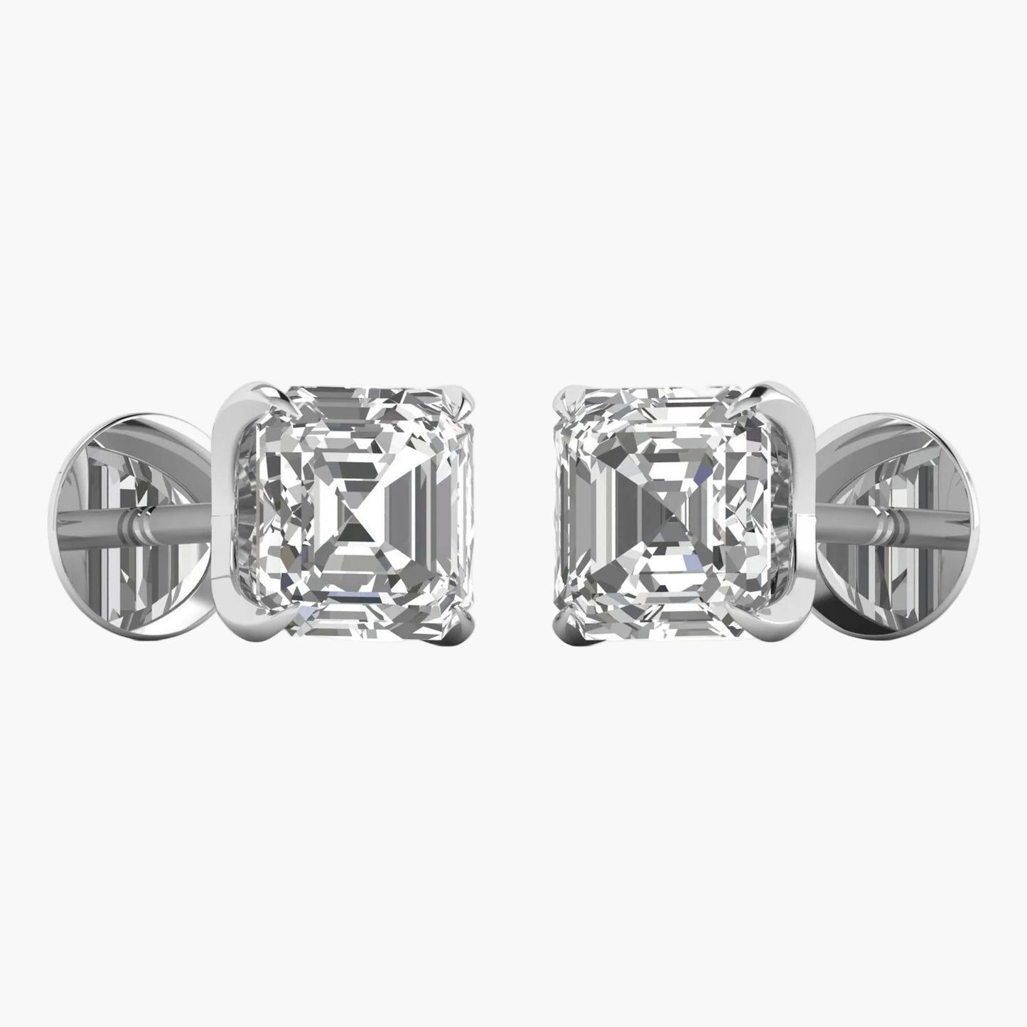 Pair of diamond stud earrings on a white background