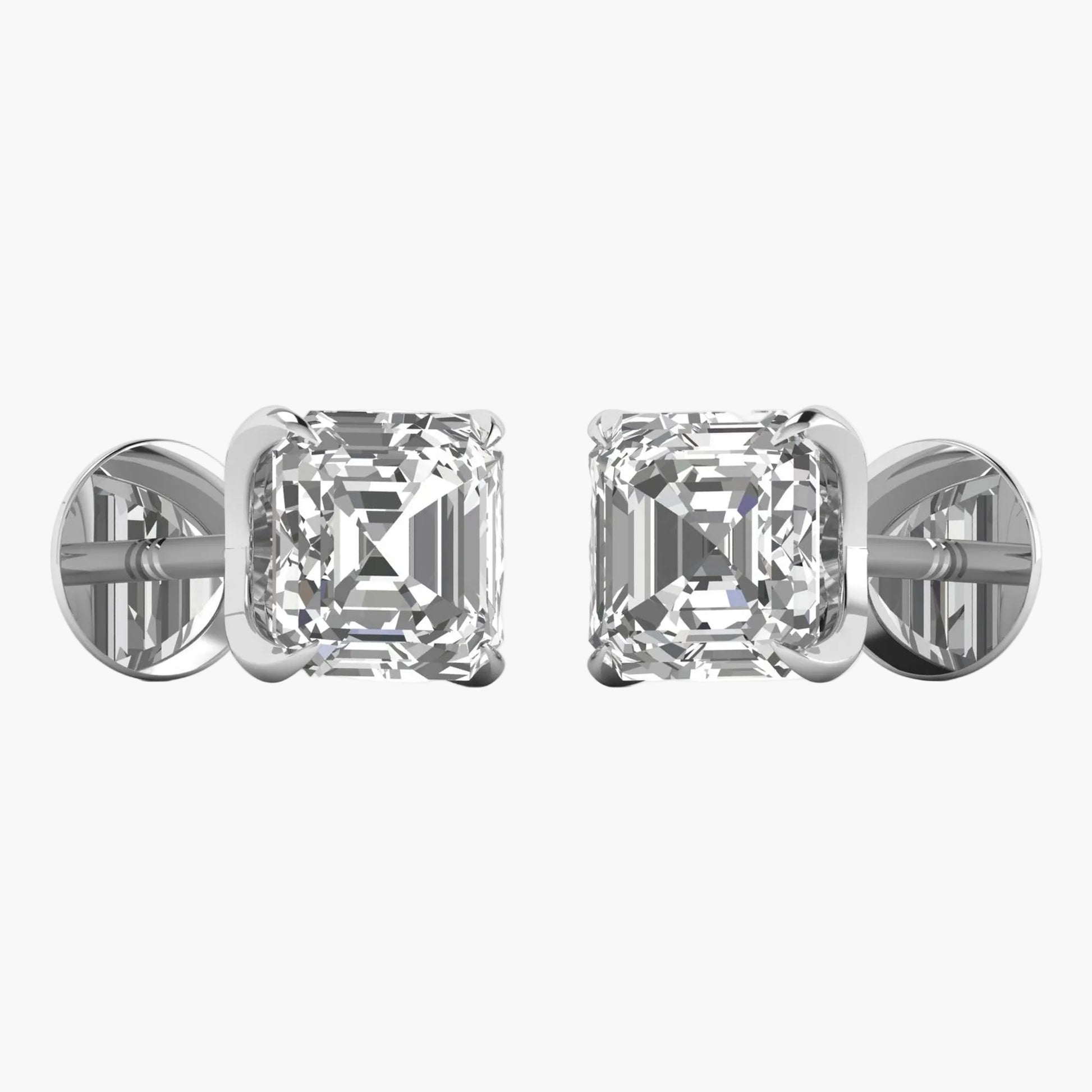 Pair of diamond stud earrings on a white background