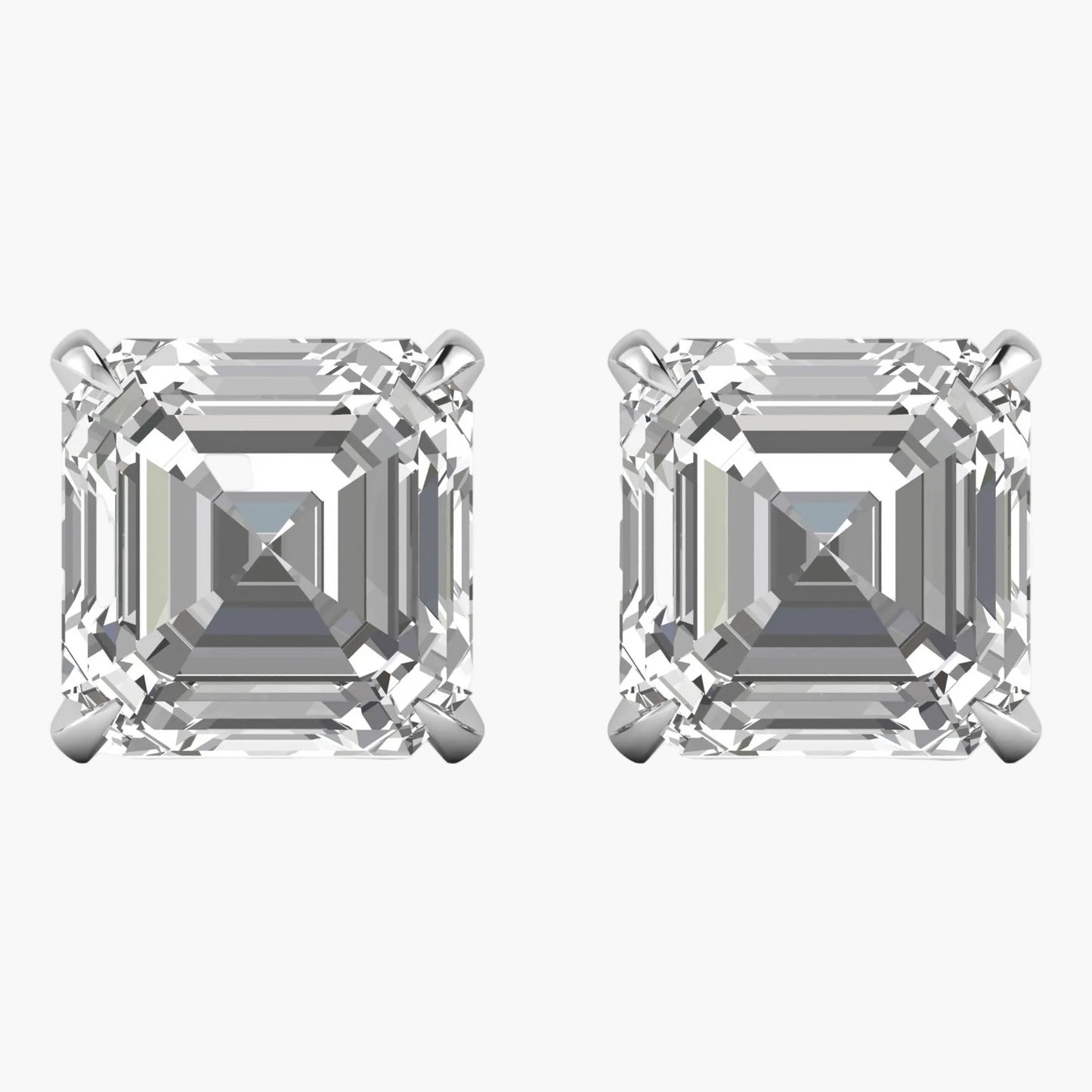 Pair of diamond stud earrings with asscher cut stones on a white background