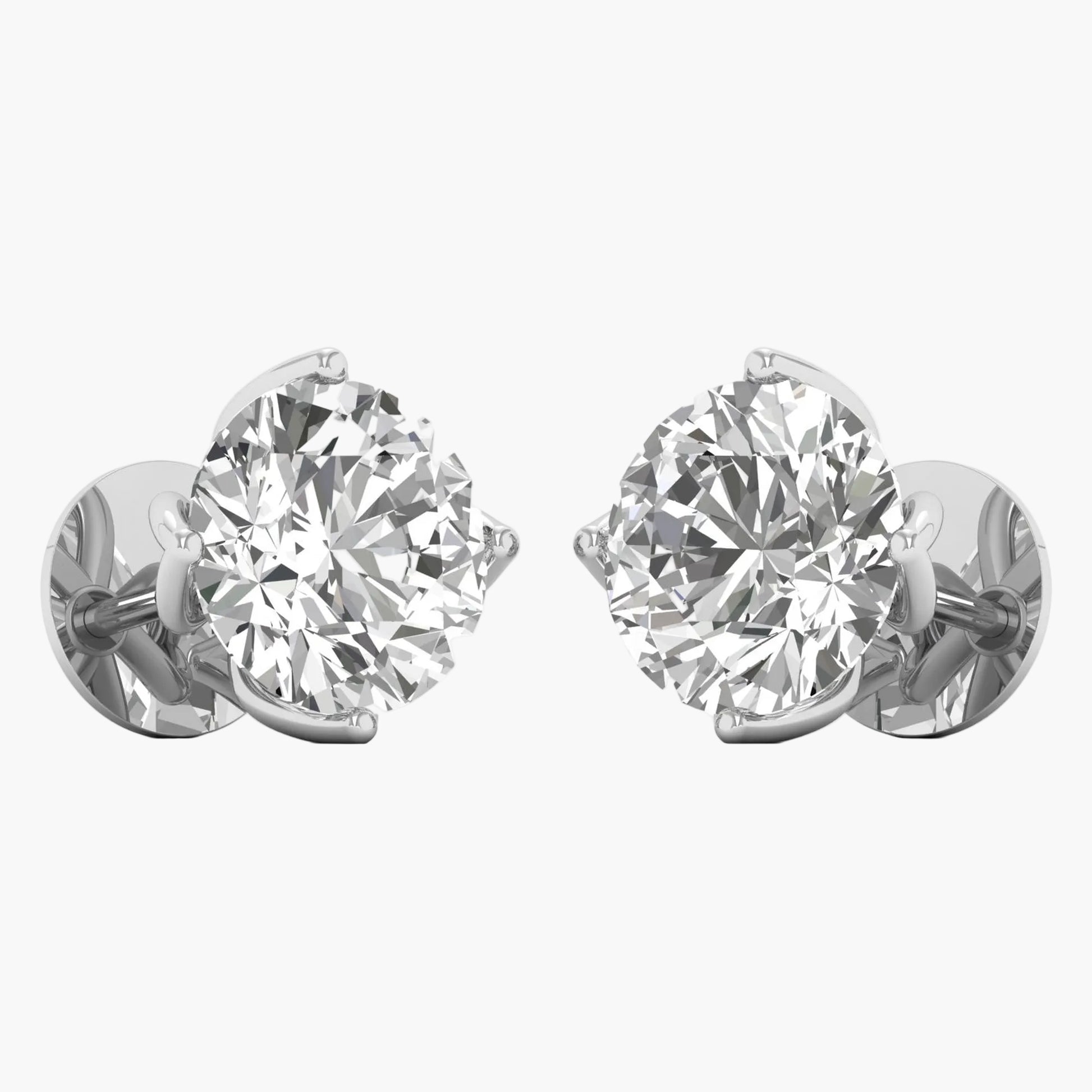 Pair of diamond stud earrings on a white background