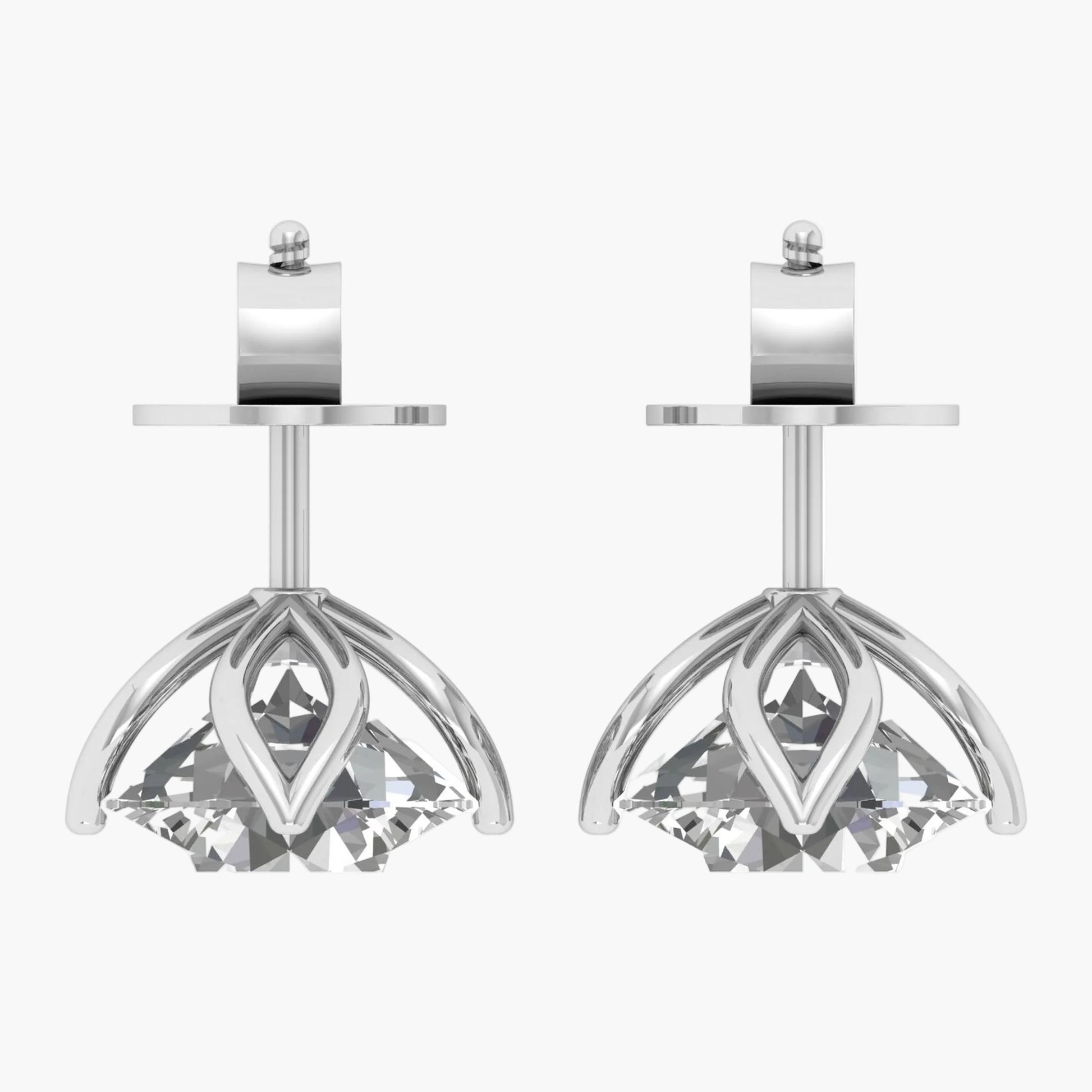 Pair of silver earrings with clear gemstones on a white background