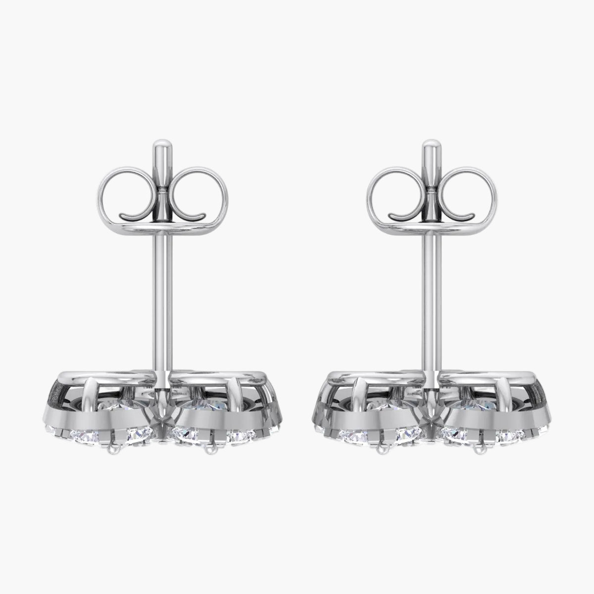 Pair of silver earrings with clear gemstones on a white background