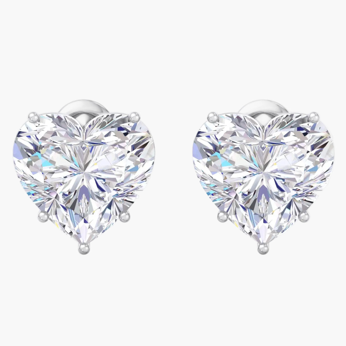 Heart-shaped diamond earrings on a white background