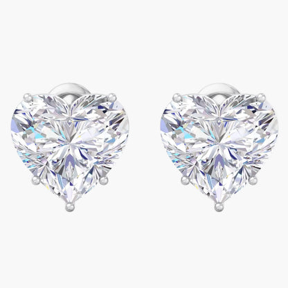 Heart-shaped diamond earrings on a white background