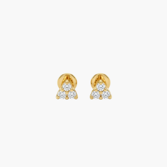 A pair of gold stud earrings with a triangular cluster of small clear gemstones, shown on a plain light gray background.