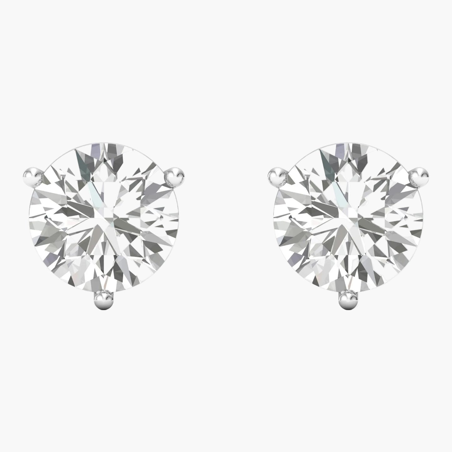 Pair of diamond stud earrings on a white background