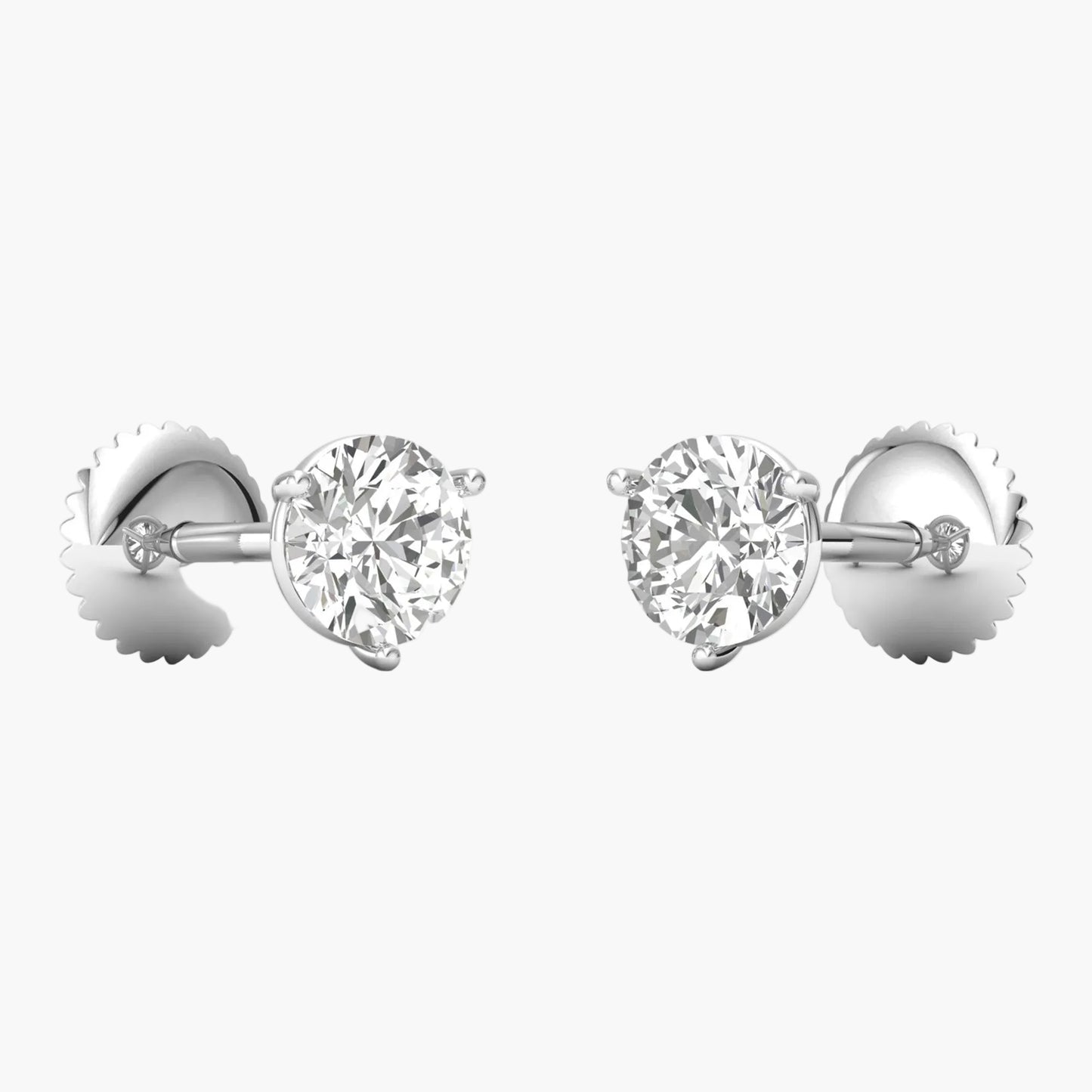 Pair of diamond stud earrings on a white background