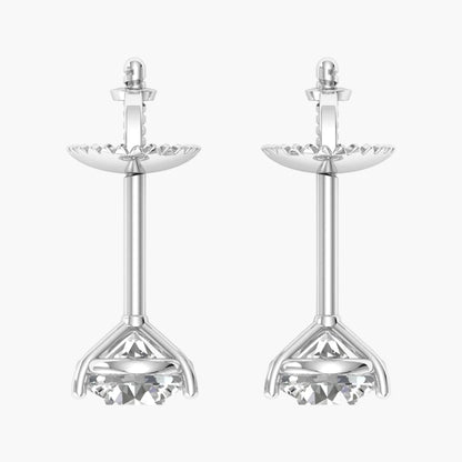 Pair of silver earrings with intricate designs on a white background