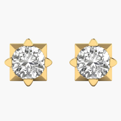Pair of gold earrings with clear gemstones on a white background